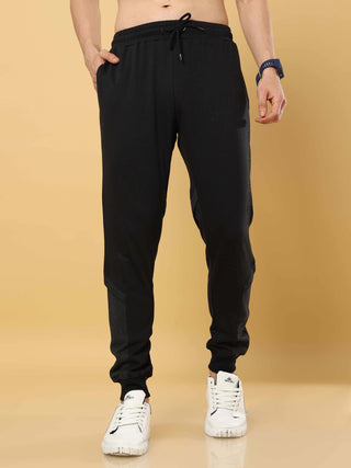 Black Joggers With Adjustable Draw String shop online at Estilocus. •High GSM knitted breathable fabric. •Elastic waistband with an adjustable drawcord secures your fit • Bottom rib with patchwork fabric with finest quality print unique design. • Insert p