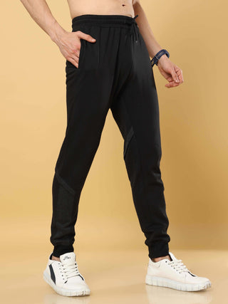 Black Joggers With Adjustable Draw String shop online at Estilocus. •High GSM knitted breathable fabric. •Elastic waistband with an adjustable drawcord secures your fit • Bottom rib with patchwork fabric with finest quality print unique design. • Insert p