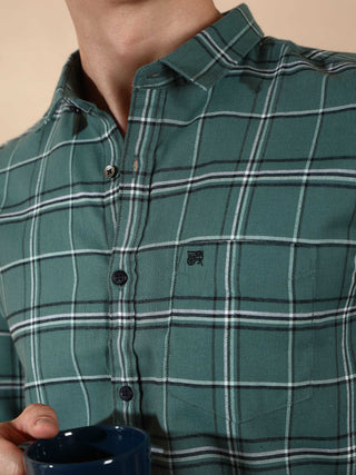 BR Green & Gray casual check full sleeve shirt shop online at Estilocus. • 100% PREMIUM COTTON • Full-sleeve solid shirt• Cut and sew placket• Regular collar• Double button square cuff.• Single pocket with logo embroidery• Curved hemline• Finest quality s