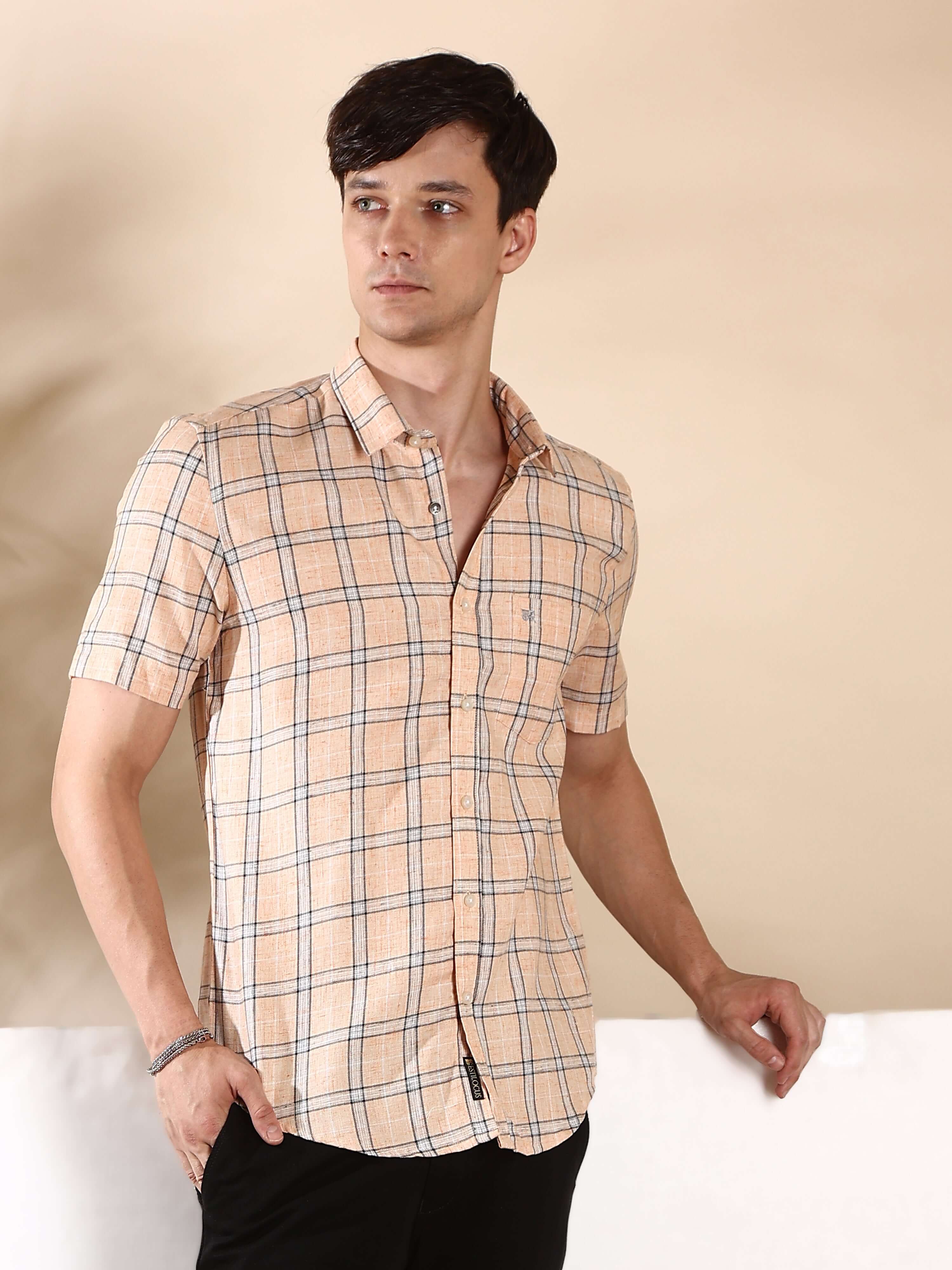 Orange casual check half sleeves shirt shop online at Estilocus. • Half-sleeve check shirt• Cut and sew placket• Regular collar• Single pocket with logo embroidery• Curved hemline• Finest quality sewing• Machine wash care• Suitable to wear with all types