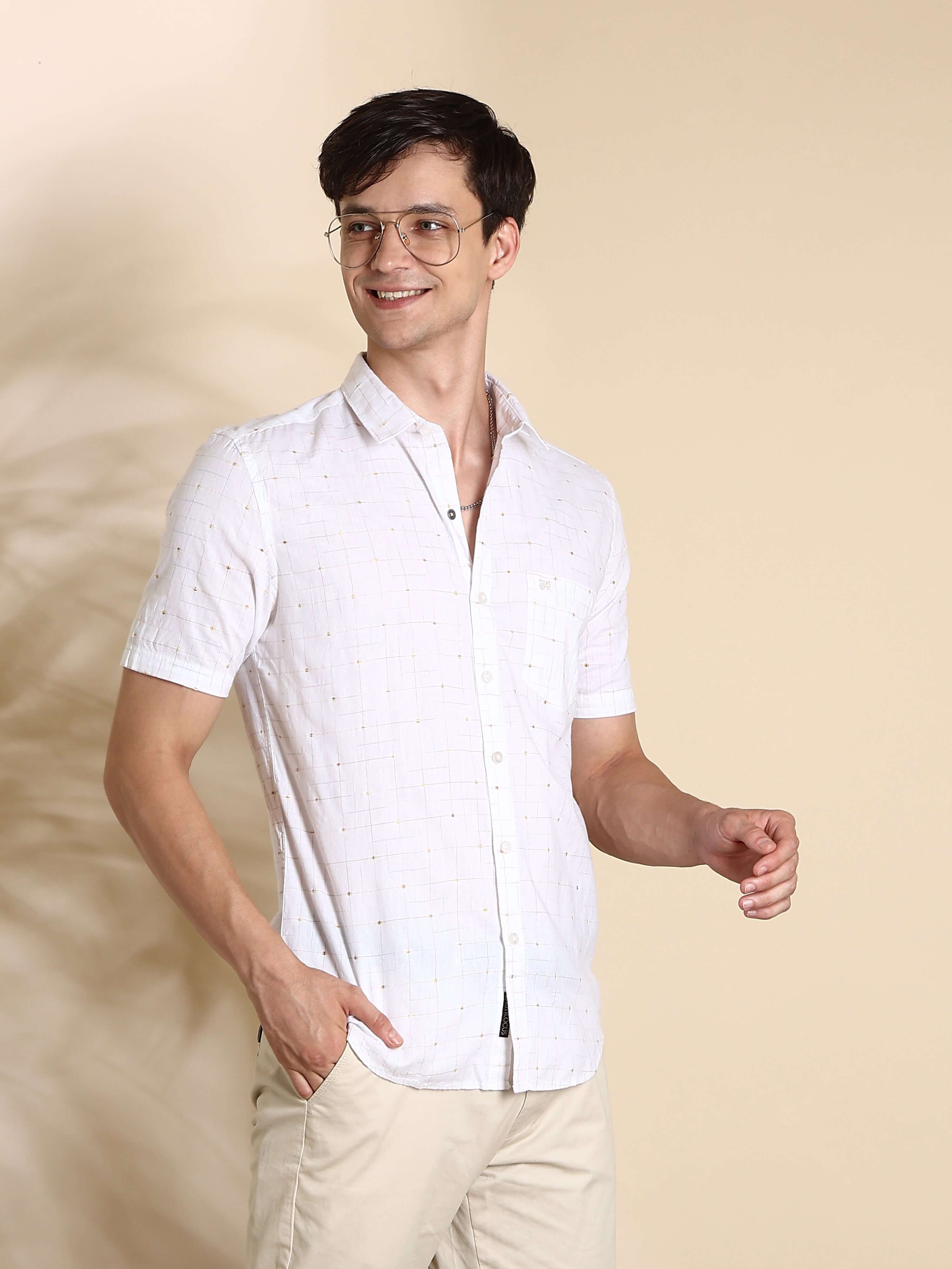 White casual check half sleeves shirt shop online at Estilocus. • Half-sleeve check shirt• Cut and sew placket• Regular collar• Single pocket with logo embroidery• Curved hemline• Finest quality sewing• Machine wash care• Suitable to wear with all types o