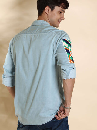 EST-Lt Blue Denim Double Pocket Shirt shop online at Estilocus. 100% premium Denim Denim ,Full-sleeve shirt cut and sew placket. Regular collar Double button edge cuff Double pocket with flap Curved bottom hemline HD elegant print @ sleeve All Double need