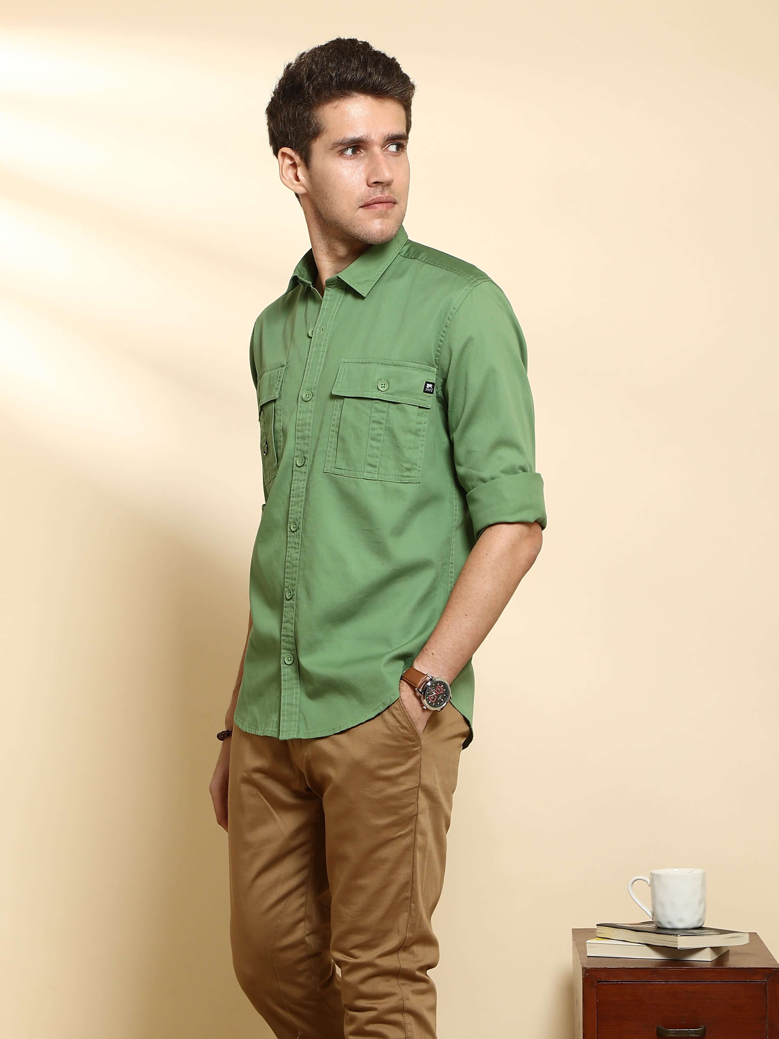 Green Cargo casual full sleeve shirt shop online at Estilocus. • 100% PREMIUM COTTON • Full-sleeve solid shirt• Cut and sew placket• Regular collar• Double button round cuffs.• Double pocket with flap• Curved hemline• Finest quality sewing with all double