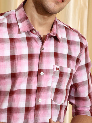 Pink check casual full sleeve shirt shop online at Estilocus. • 100% PREMIUM COTTON • Full-sleeve check shirt• Cut and sew placket• Regular collar• Double button square cuff.• Single pocket with logo embroidery• Curved hemline• Finest quality sewing with