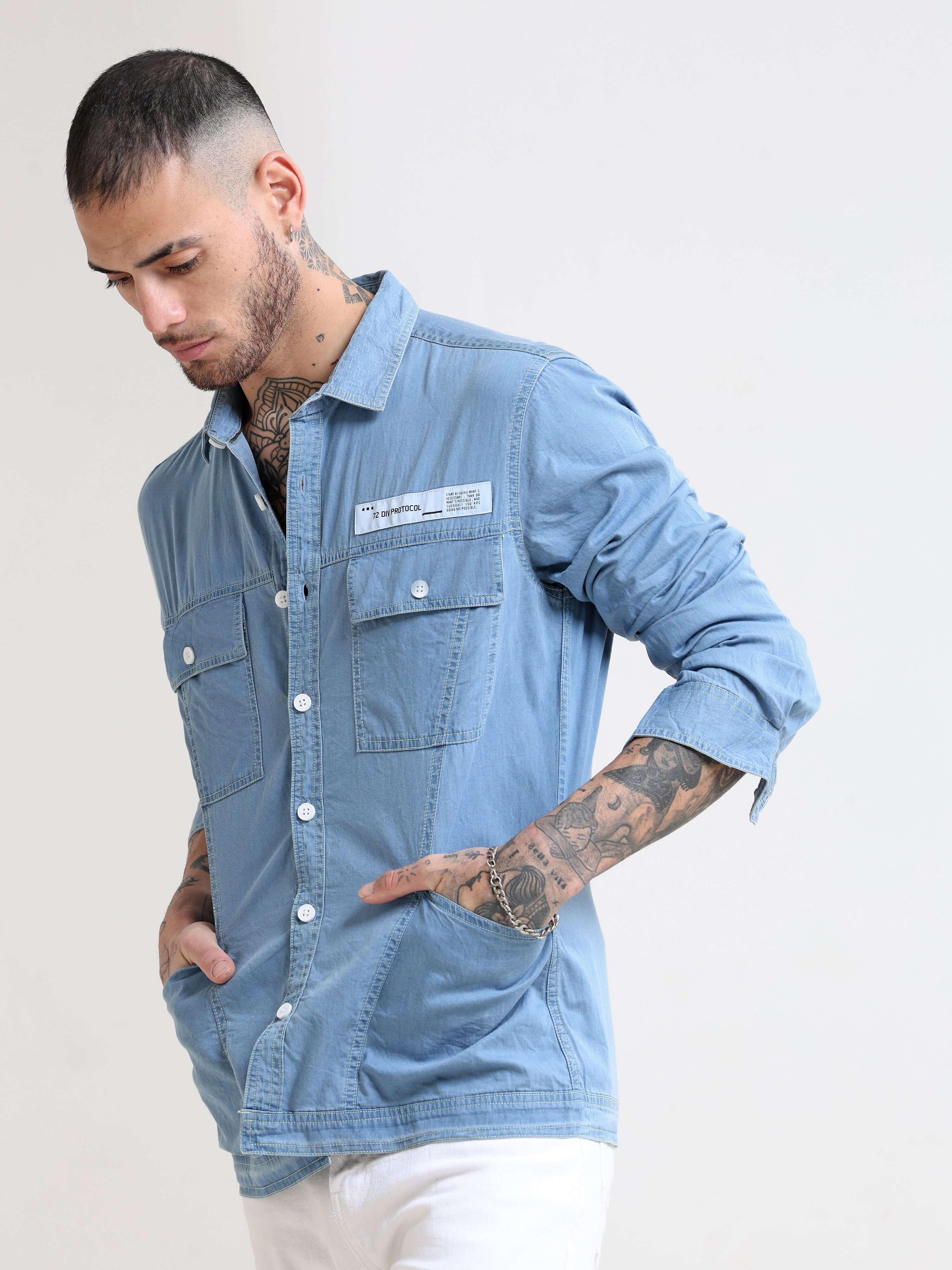 Genie Ice Blue Denim Overshirt shop online at Estilocus. 100% premium Denim Full-sleeve shirt Cut and sew placket. Regular collar Double button edge cuff Double pocket, other end with flap pocket Curved bottom hemline HD elegant print at panal All Double