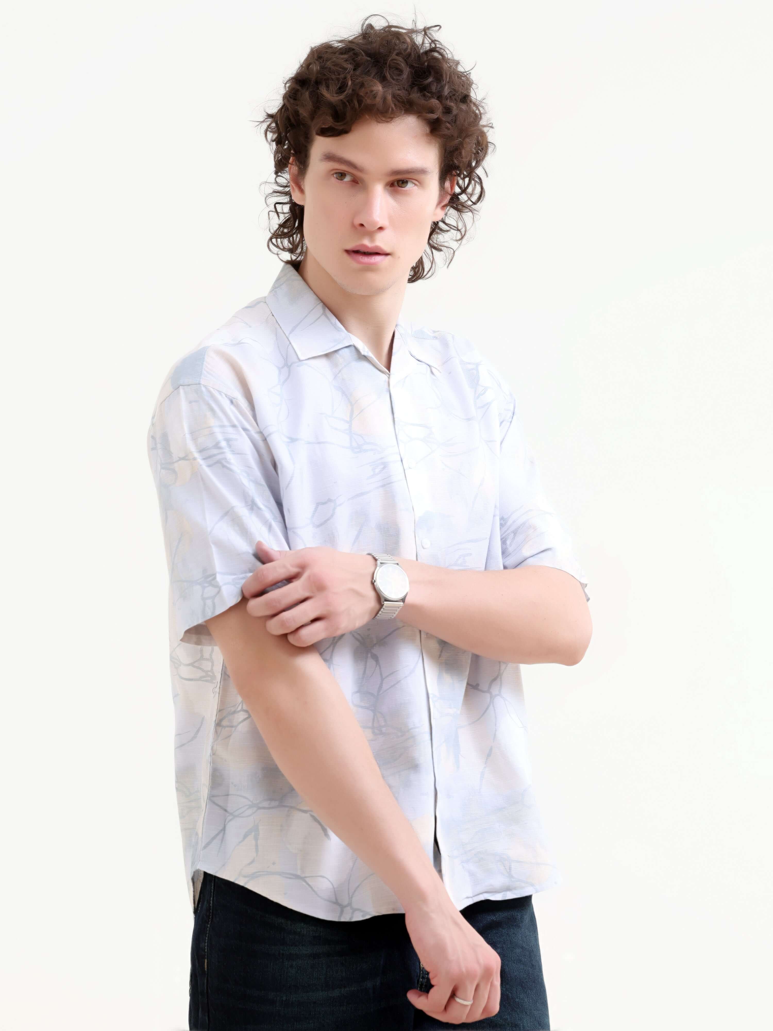 Mirajo Men's Dusky Blue Oversized Shirt shop online at Estilocus. Shop the new Mirajo oversized shirt for a breezy summer style. Light, airy, and perfect for casual days. Get your Hawaiian vibe on!