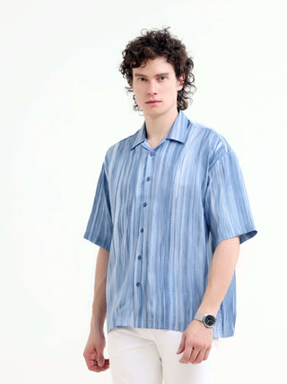 Men's Pastel Blue Oversized Shirt - Summer Casual shop online at Estilocus. Shop new arrivals: Tonal pastel blue shirt for a relaxed summer style. Lightweight, oversized fit for ultimate comfort. Order yours today!