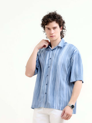 Men's Pastel Blue Oversized Shirt - Summer Casual shop online at Estilocus. Shop new arrivals: Tonal pastel blue shirt for a relaxed summer style. Lightweight, oversized fit for ultimate comfort. Order yours today!