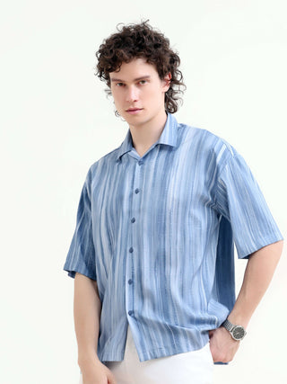 Men's Pastel Blue Oversized Shirt - Summer Casual shop online at Estilocus. Shop new arrivals: Tonal pastel blue shirt for a relaxed summer style. Lightweight, oversized fit for ultimate comfort. Order yours today!