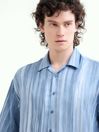 Men's Pastel Blue Oversized Shirt - Summer Casual shop online at Estilocus. Shop new arrivals: Tonal pastel blue shirt for a relaxed summer style. Lightweight, oversized fit for ultimate comfort. Order yours today!