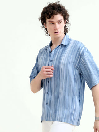 Men's Pastel Blue Oversized Shirt - Summer Casual shop online at Estilocus. Shop new arrivals: Tonal pastel blue shirt for a relaxed summer style. Lightweight, oversized fit for ultimate comfort. Order yours today!