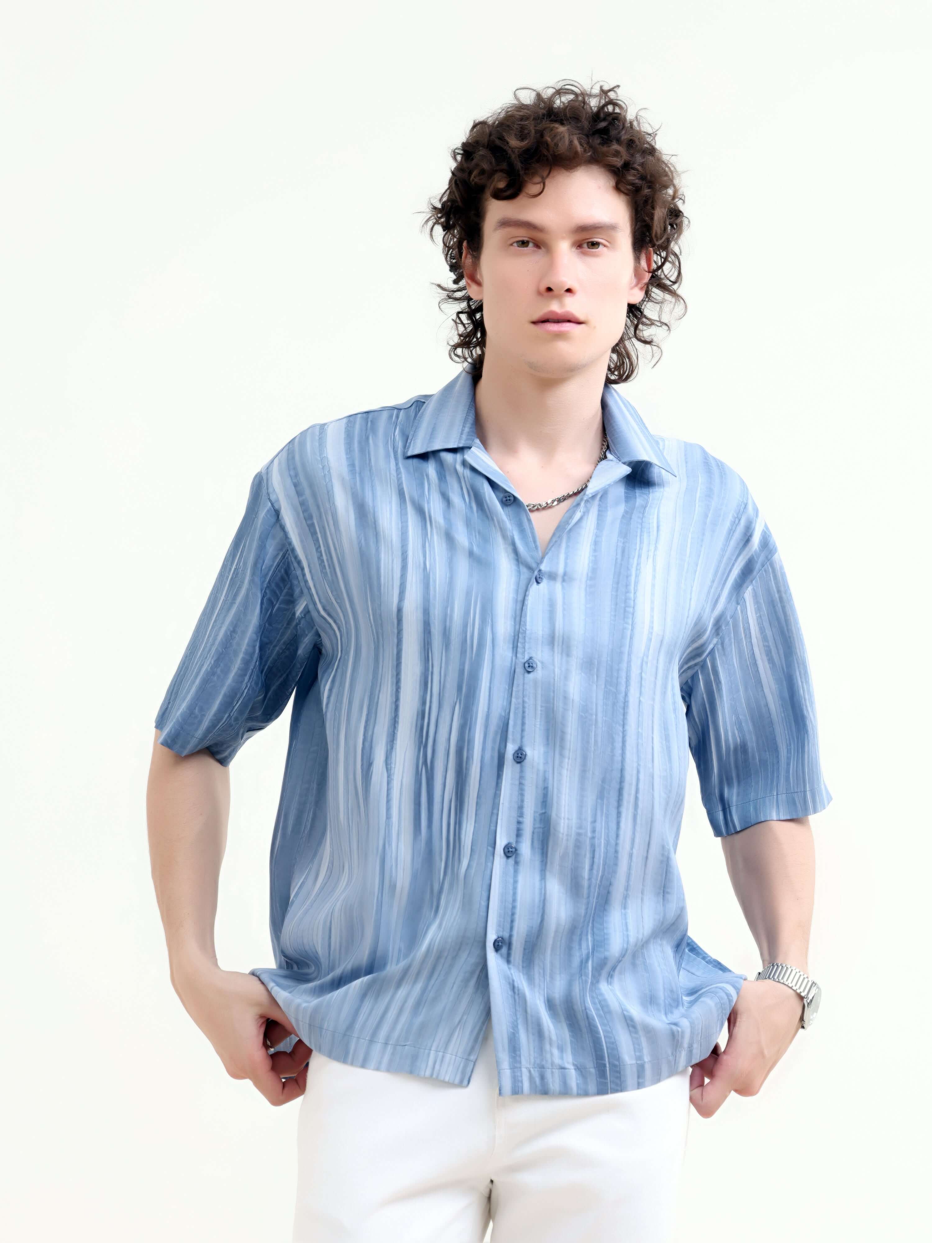 Men's Pastel Blue Oversized Shirt - Summer Casual shop online at Estilocus. Shop new arrivals: Tonal pastel blue shirt for a relaxed summer style. Lightweight, oversized fit for ultimate comfort. Order yours today!