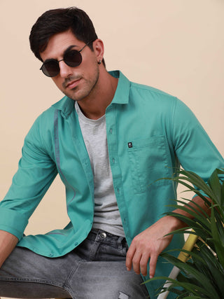 Aqua Marine Solid Single Pocket full sleeve Shirt shop online at Estilocus. 100% Cotton ,Full-sleeve solid shirt Cut and sew placket Regular collar Double button edge cuff Single pocket Curved bottom hemline Finest printing at front placket. All double ne