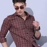 Brown Check Casual Shirt shop online at Estilocus. • Full-sleeve brown colured check shirt with regular collar• Cut and sew placket • Double button square cuff. • Single pocket with logo embroidery • Curved hemline • Finest quality sewing • Machine wash c
