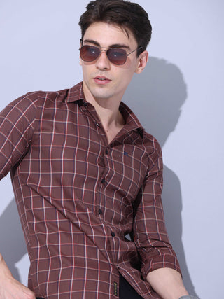 Brown Check Casual Shirt shop online at Estilocus. • Full-sleeve brown colured check shirt with regular collar• Cut and sew placket • Double button square cuff. • Single pocket with logo embroidery • Curved hemline • Finest quality sewing • Machine wash c