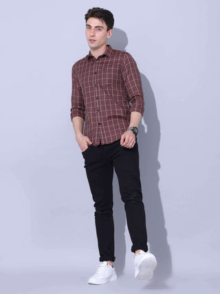 Brown Check Casual Shirt shop online at Estilocus. • Full-sleeve brown colured check shirt with regular collar• Cut and sew placket • Double button square cuff. • Single pocket with logo embroidery • Curved hemline • Finest quality sewing • Machine wash c