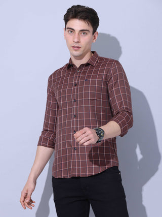 Brown Check Casual Shirt shop online at Estilocus. • Full-sleeve brown colured check shirt with regular collar• Cut and sew placket • Double button square cuff. • Single pocket with logo embroidery • Curved hemline • Finest quality sewing • Machine wash c