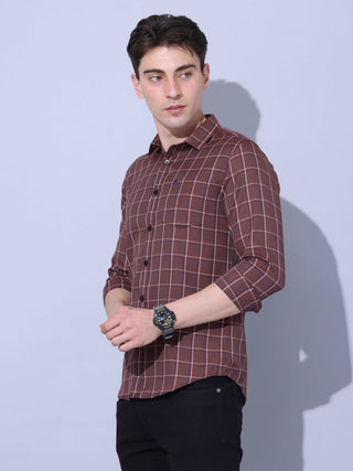 Brown Check Casual Shirt shop online at Estilocus. • Full-sleeve brown colured check shirt with regular collar• Cut and sew placket • Double button square cuff. • Single pocket with logo embroidery • Curved hemline • Finest quality sewing • Machine wash c