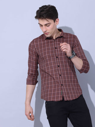 Brown Check Casual Shirt shop online at Estilocus. • Full-sleeve brown colured check shirt with regular collar• Cut and sew placket • Double button square cuff. • Single pocket with logo embroidery • Curved hemline • Finest quality sewing • Machine wash c