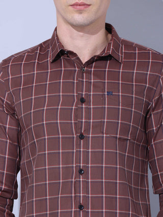 Brown Check Casual Shirt shop online at Estilocus. • Full-sleeve brown colured check shirt with regular collar• Cut and sew placket • Double button square cuff. • Single pocket with logo embroidery • Curved hemline • Finest quality sewing • Machine wash c