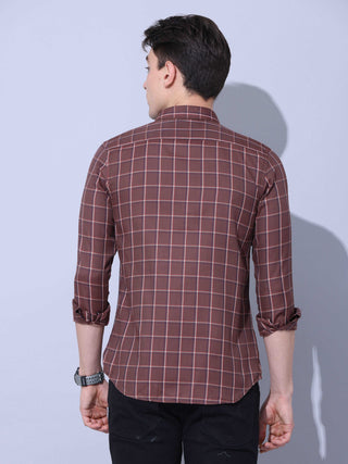 Brown Check Casual Shirt shop online at Estilocus. • Full-sleeve brown colured check shirt with regular collar• Cut and sew placket • Double button square cuff. • Single pocket with logo embroidery • Curved hemline • Finest quality sewing • Machine wash c