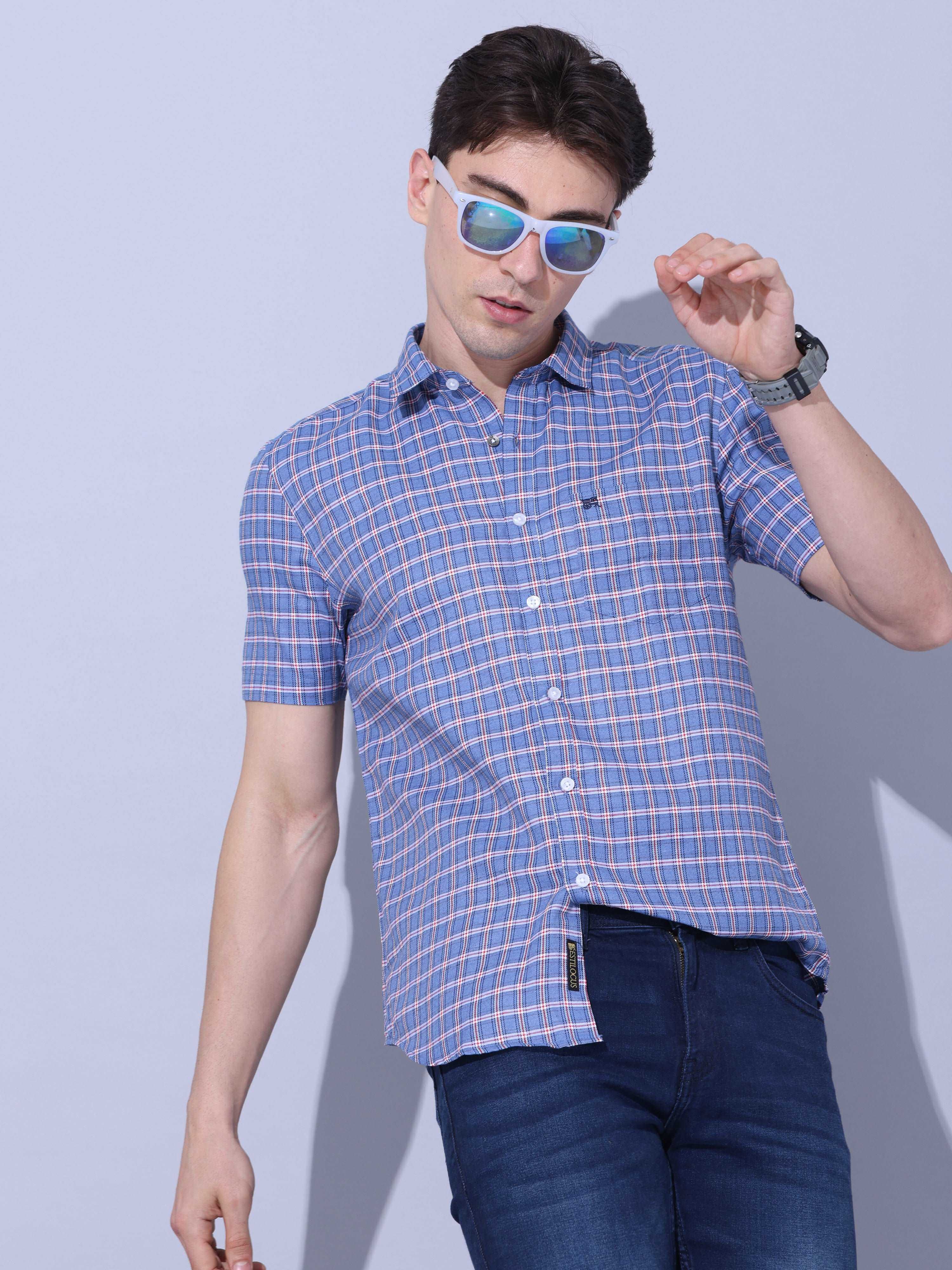 Blue Check Casual half sleeve Shirt shop online at Estilocus. • This blue checkered full sleeve shirt is a perfect addition to any man's wardrobe • Cut and sew placket • Regular collar • Single pocket with logo embroidery • Curved hemline • Finest quality