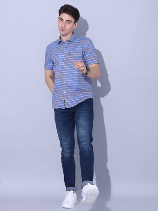 Blue Check Casual half sleeve Shirt shop online at Estilocus. • This blue checkered full sleeve shirt is a perfect addition to any man's wardrobe • Cut and sew placket • Regular collar • Single pocket with logo embroidery • Curved hemline • Finest quality