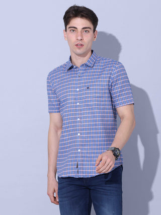 Blue Check Casual half sleeve Shirt shop online at Estilocus. • This blue checkered full sleeve shirt is a perfect addition to any man's wardrobe • Cut and sew placket • Regular collar • Single pocket with logo embroidery • Curved hemline • Finest quality