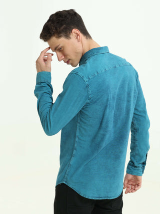 Denim Indigo-Teal over-dyed casual shirt shop online at Estilocus. • 100% premium Denim• Full-sleeve solid shirt• Cut and sew placket• Regular collar• Double button round cuff's.• Single pocket • Cut and sew front panel with high-quality print• Curved hem