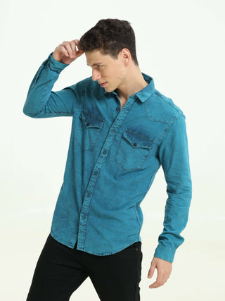 Denim Indigo-Teal over-dyed casual shirt shop online at Estilocus. • 100% premium Denim• Full-sleeve solid shirt• Cut and sew placket• Regular collar• Double button round cuff's.• Single pocket • Cut and sew front panel with high-quality print• Curved hem