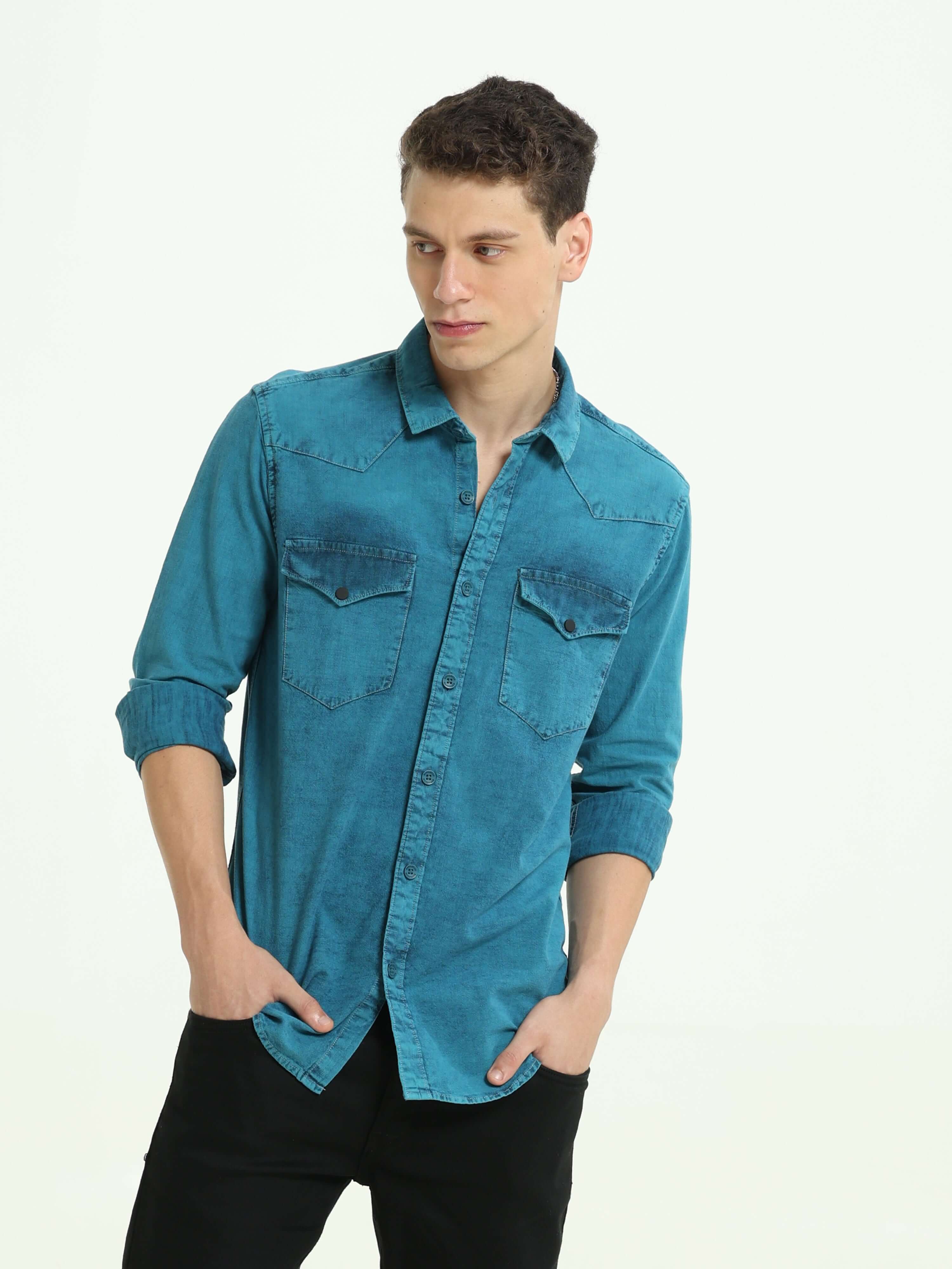 Denim Indigo-Teal over-dyed casual shirt shop online at Estilocus. • 100% premium Denim• Full-sleeve solid shirt• Cut and sew placket• Regular collar• Double button round cuff's.• Single pocket • Cut and sew front panel with high-quality print• Curved hem