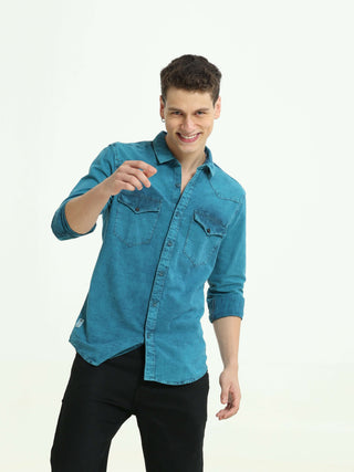 Denim Indigo-Teal over-dyed casual shirt shop online at Estilocus. • 100% premium Denim• Full-sleeve solid shirt• Cut and sew placket• Regular collar• Double button round cuff's.• Single pocket • Cut and sew front panel with high-quality print• Curved hem