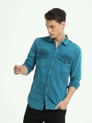 Denim Indigo-Teal over-dyed casual shirt shop online at Estilocus. • 100% premium Denim• Full-sleeve solid shirt• Cut and sew placket• Regular collar• Double button round cuff's.• Single pocket • Cut and sew front panel with high-quality print• Curved hem