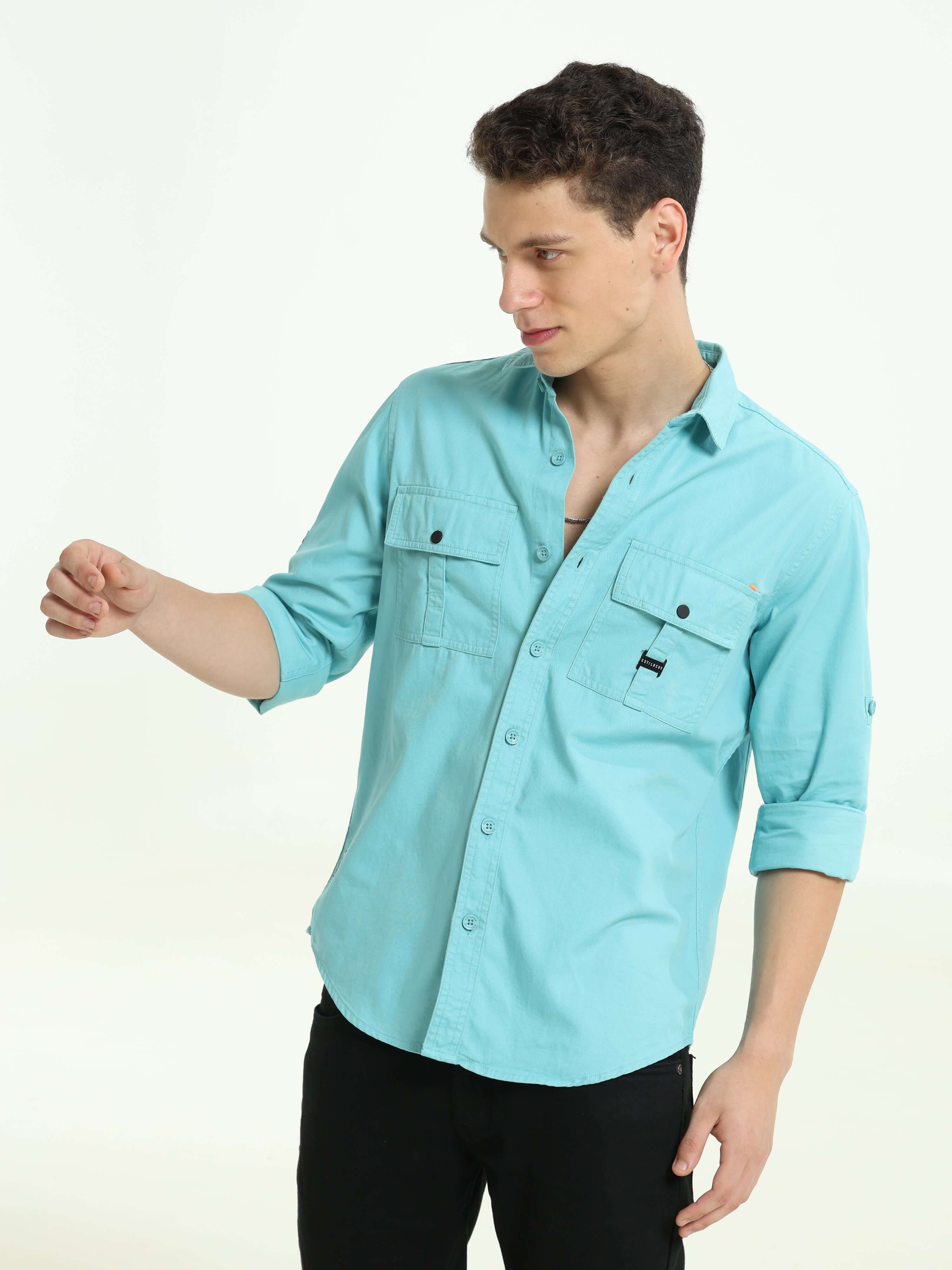Vivid sky Solid double pocket shirt shop online at Estilocus. 100% Cotton • Full-sleeve solid shirt• Cut and sew placket• Regular collar• Double button edge cuff • Double pocket with flap • Curved bottom hemline• Finest printing at front placket. • All do