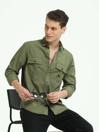 Moss green Solid double pocket shirt shop online at Estilocus. 100% Cotton • Full-sleeve solid shirt• Cut and sew placket• Regular collar• Double button edge cuff • Double pocket with flap • Curved bottom hemline• Finest printing at front placket. • All d