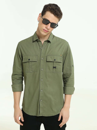 Moss green Solid double pocket shirt shop online at Estilocus. 100% Cotton • Full-sleeve solid shirt• Cut and sew placket• Regular collar• Double button edge cuff • Double pocket with flap • Curved bottom hemline• Finest printing at front placket. • All d