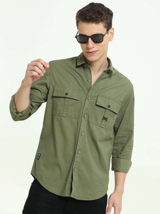 Moss green Solid double pocket shirt shop online at Estilocus. 100% Cotton • Full-sleeve solid shirt• Cut and sew placket• Regular collar• Double button edge cuff • Double pocket with flap • Curved bottom hemline• Finest printing at front placket. • All d