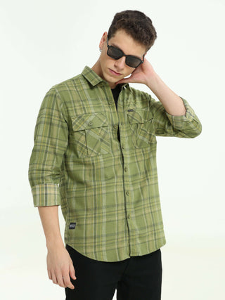 Olive green Check double pocket shirt shop online at Estilocus. 100% Cotton • Full-sleeve check shirt• Cut and sew placket• Regular collar• Double button edge cuff• Double pocket with flap• Curved bottom hemline .• All double needle construction, finest q