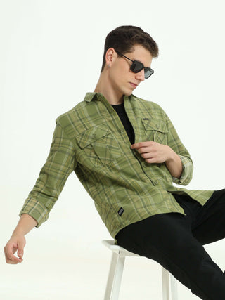 Olive green Check double pocket shirt shop online at Estilocus. 100% Cotton • Full-sleeve check shirt• Cut and sew placket• Regular collar• Double button edge cuff• Double pocket with flap• Curved bottom hemline .• All double needle construction, finest q