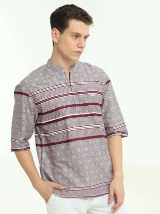 Oversized maroon colour printed kurta shop online at Estilocus. • Five-sleeve stripe printed kurta• Mandarin collar• Single button square cuff.• Single pocket with logo embroidery• Curved hemline• All Single-needle construction, finest quality sewing• Mac