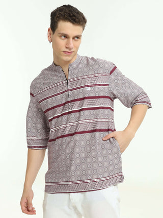 Oversized maroon colour printed kurta shop online at Estilocus. • Five-sleeve stripe printed kurta• Mandarin collar• Single button square cuff.• Single pocket with logo embroidery• Curved hemline• All Single-needle construction, finest quality sewing• Mac