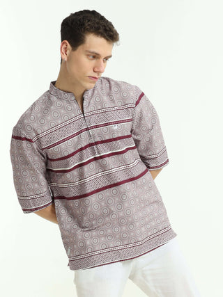 Oversized maroon colour printed kurta shop online at Estilocus. • Five-sleeve stripe printed kurta• Mandarin collar• Single button square cuff.• Single pocket with logo embroidery• Curved hemline• All Single-needle construction, finest quality sewing• Mac