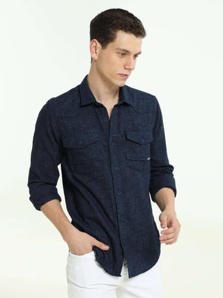 Indigo navy solid double pocket shirt shop online at Estilocus. 100% Cotton • Full-sleeve solid shirt• Cut and sew placket• Regular collar• Double button edge cuff • Double pocket with flap • Curved bottom hemline . • All double needle construction, fines