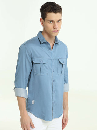 Tufts blue solid double pocket shirt shop online at Estilocus. 100% Cotton • Full-sleeve denim shirt• Cut and sew placket• Regular collar• Double button edge cuff • Double pocket with flap • Curved bottom hemline . • All double needle construction, finest