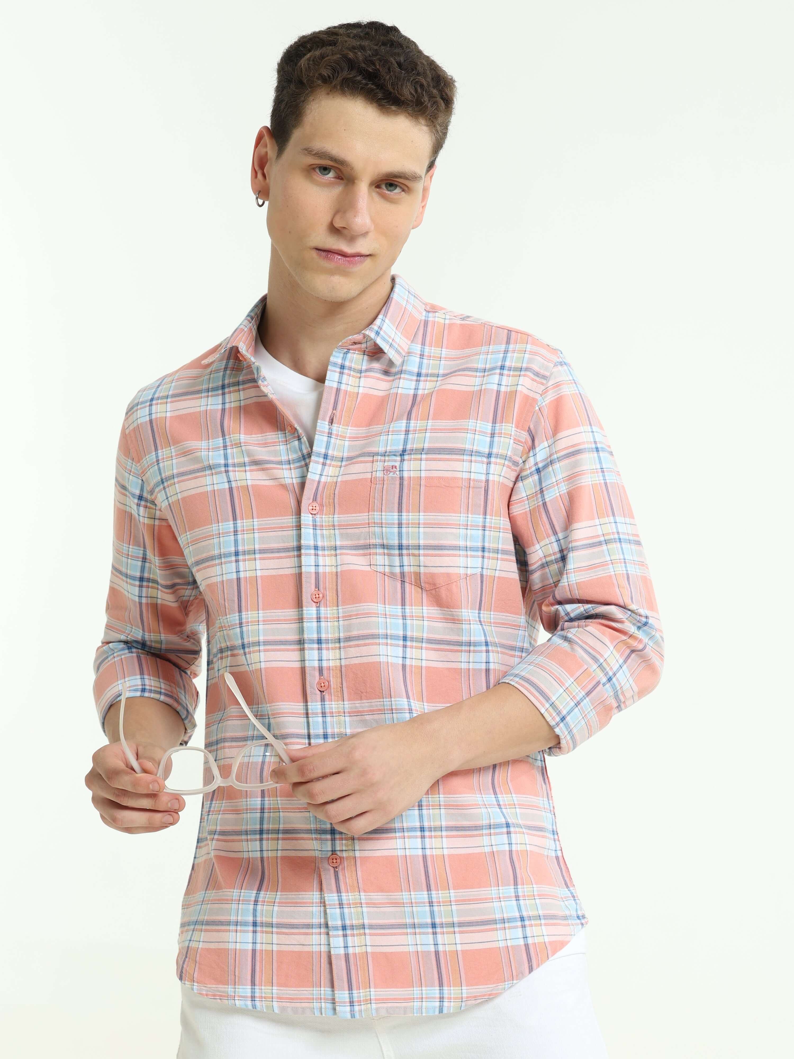 Pink off-blue casual check shirt shop online at Estilocus. • Full-sleeve check shirt• Cut and sew placket• Regular collar• Double button square cuff.• Single pocket with logo embroidery• Curved hemline• All double-needle construction, finest quality sewin