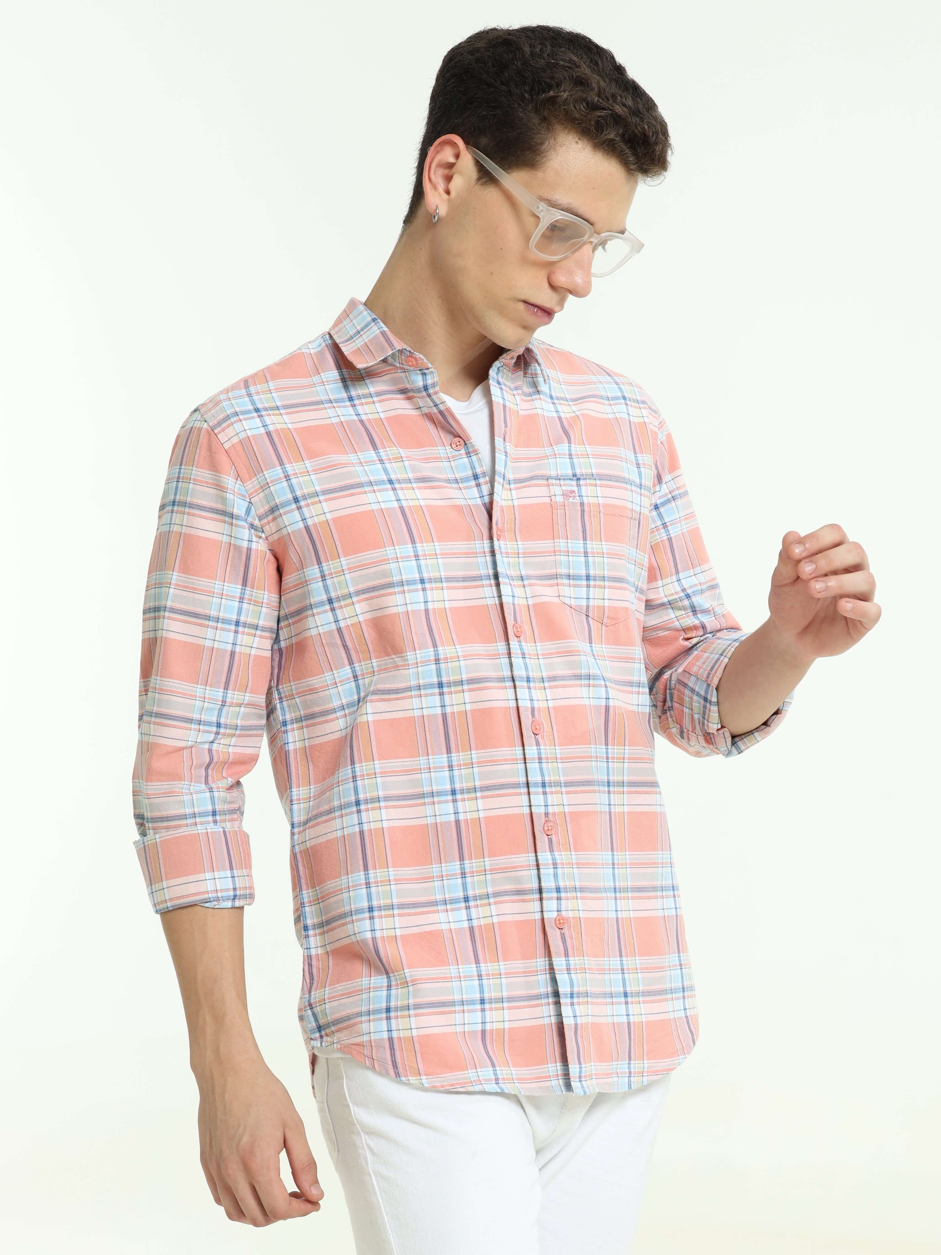Pink off-blue casual check shirt shop online at Estilocus. • Full-sleeve check shirt• Cut and sew placket• Regular collar• Double button square cuff.• Single pocket with logo embroidery• Curved hemline• All double-needle construction, finest quality sewin