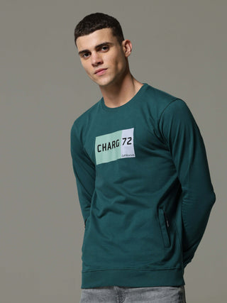 Charg Teal Sweat Shirt shop online at Estilocus. • Crew neck • Long sleeve • Ribbing around neckline, Cuff & hem • High quality print and fine embroidery Fit : Comfort fit Size : The model is wearing M size Model height : 6 Feet Wash care : Cold machine w