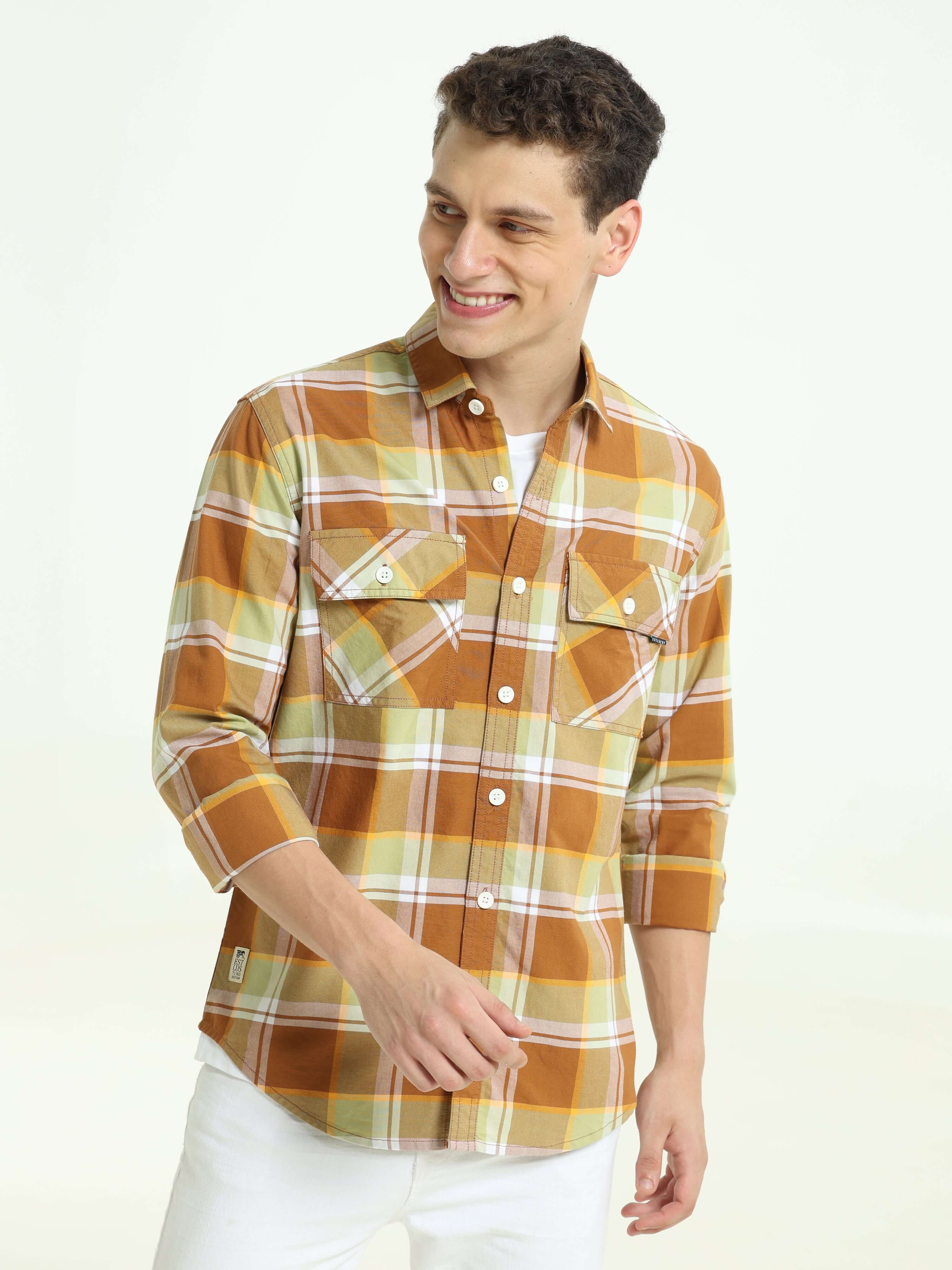 Brown off-sage casual check shirt shop online at Estilocus. 100% Cotton • Full-sleeve check shirt• Cut and sew placket• Regular collar• Double button edge cuff • Double pocket with flap • Curved bottom hemline . • All double needle construction, finest qu