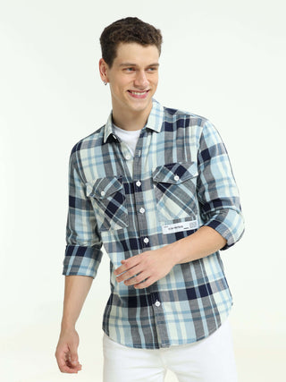 Indigo check double pocket shirt shop online at Estilocus. 100% Cotton • Full-sleeve check shirt• Cut and sew placket• Regular collar• Double button edge cuff• Double pocket with flap• Curved bottom hemline .• All double needle construction, finest qualit