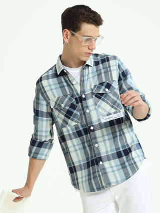 Indigo check double pocket shirt shop online at Estilocus. 100% Cotton • Full-sleeve check shirt• Cut and sew placket• Regular collar• Double button edge cuff• Double pocket with flap• Curved bottom hemline .• All double needle construction, finest qualit